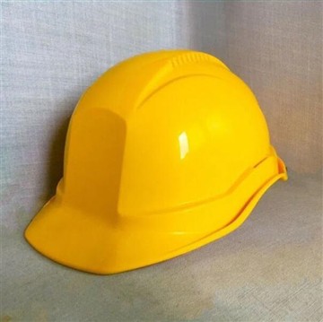 What are the different levels of protection offered by industrial safety helmets